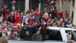 Chris Carpenter and his family wave to the crowd.